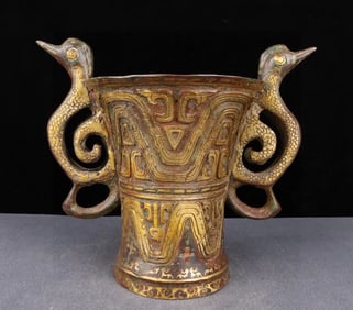 A Han Dynasty bronze Cuojin double beast ear cup