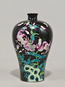 A Qing Dynasty Yongzheng year enamel black background lily plum vase