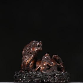 A Qing Dynasty agarwood child and mother beast ornament