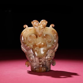A Han Dynasty white jade high relief buckle