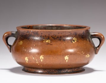 A Qing Dynasty gold and copper incense burner