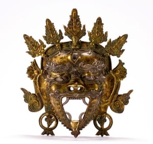 A copper gilt mask of the Qing Dynasty