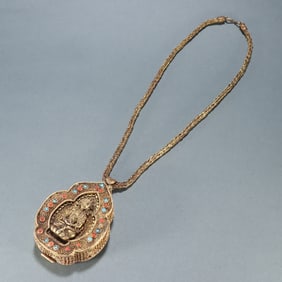 A black box made of copper gilt filigree