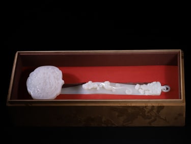 A Qing Dynasty Hetian jade dragon ruyi