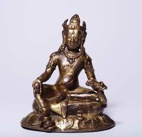 A seated statue of the God of Wealth in bronze gilt in the Qing Dynasty
