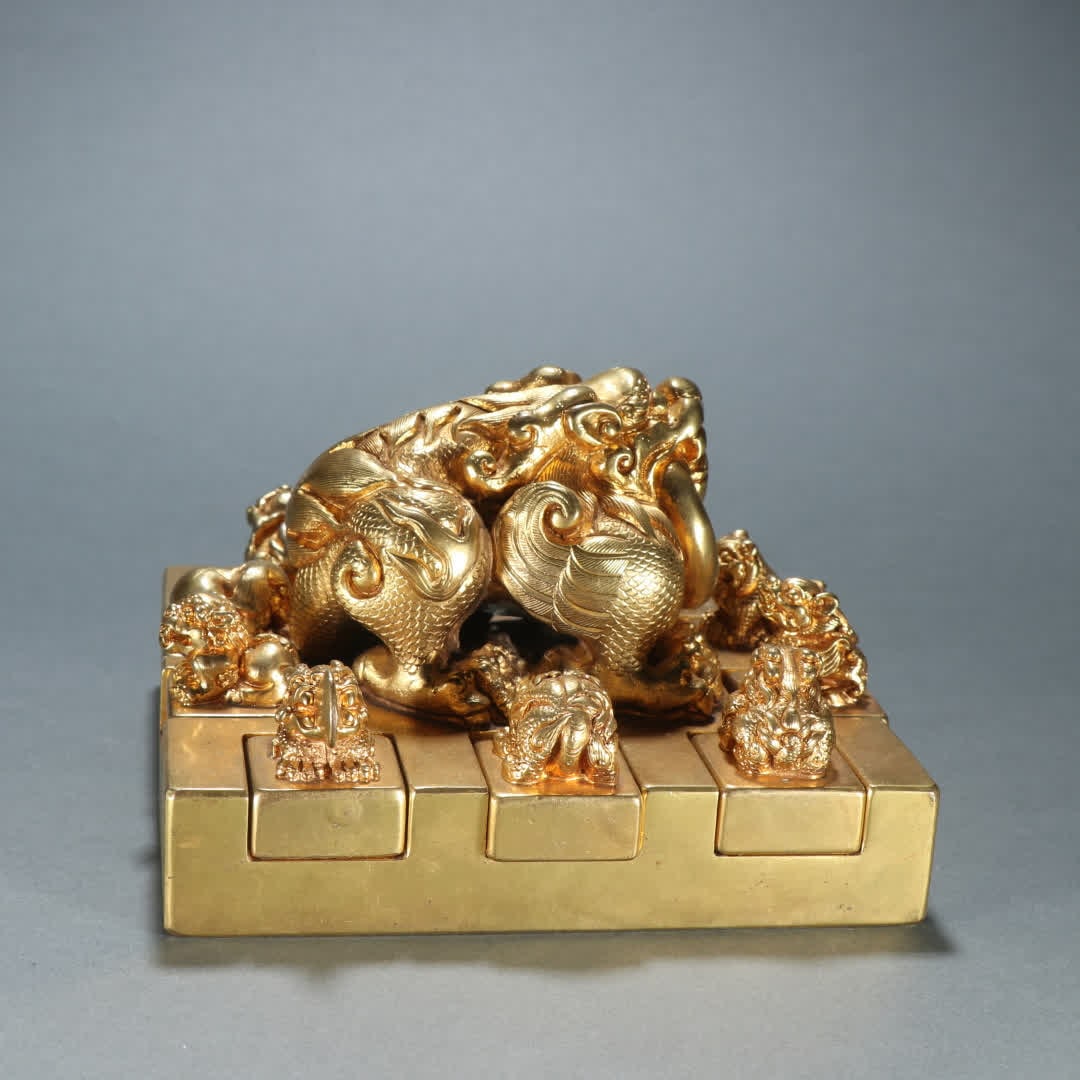 A set of copper gilt beast button seals (1 of 9)