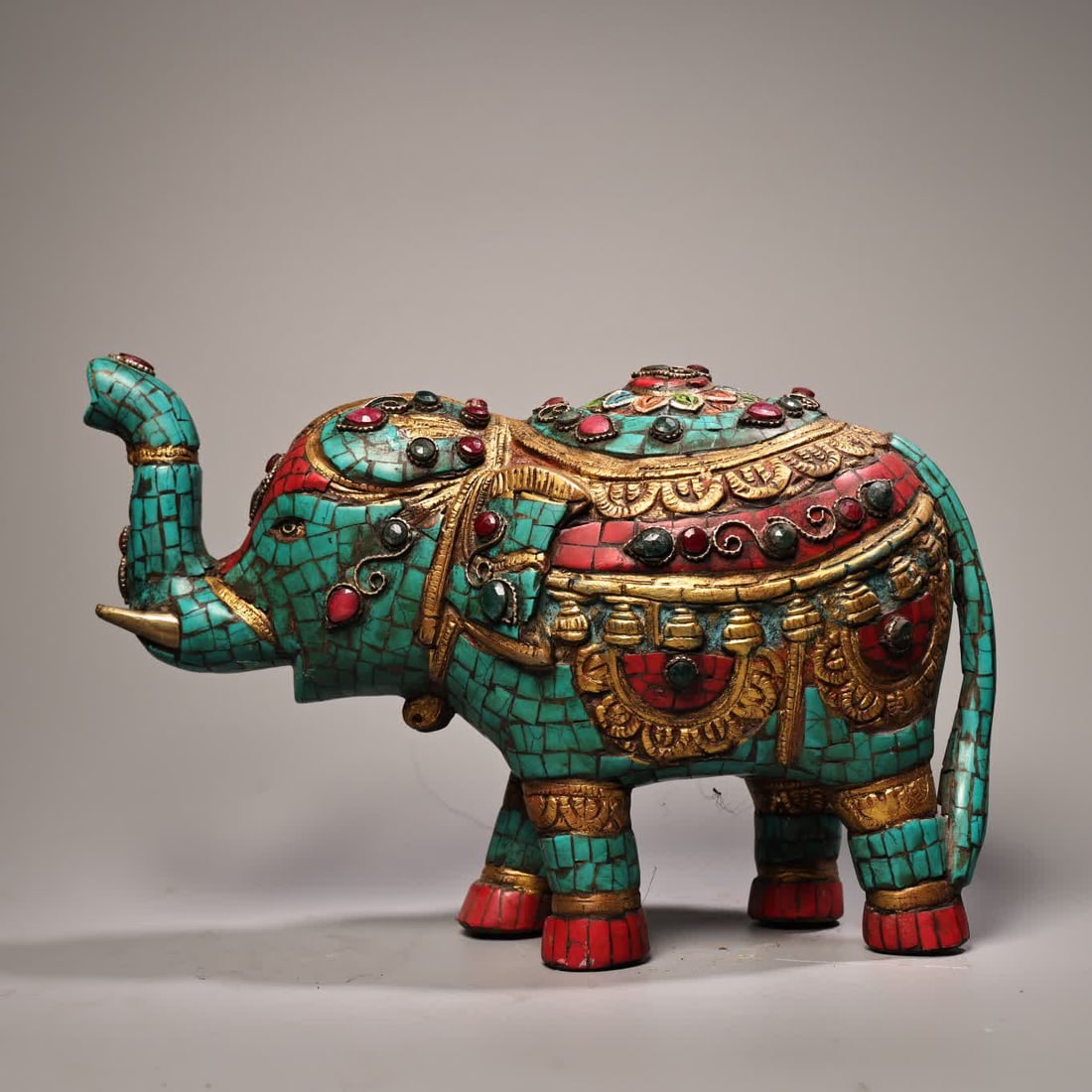 A painted elephant with gemstones and gilded on it (1 of 10)