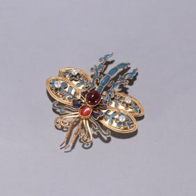 A Qing Dynasty silver-gilt emerald butterfly brooch
