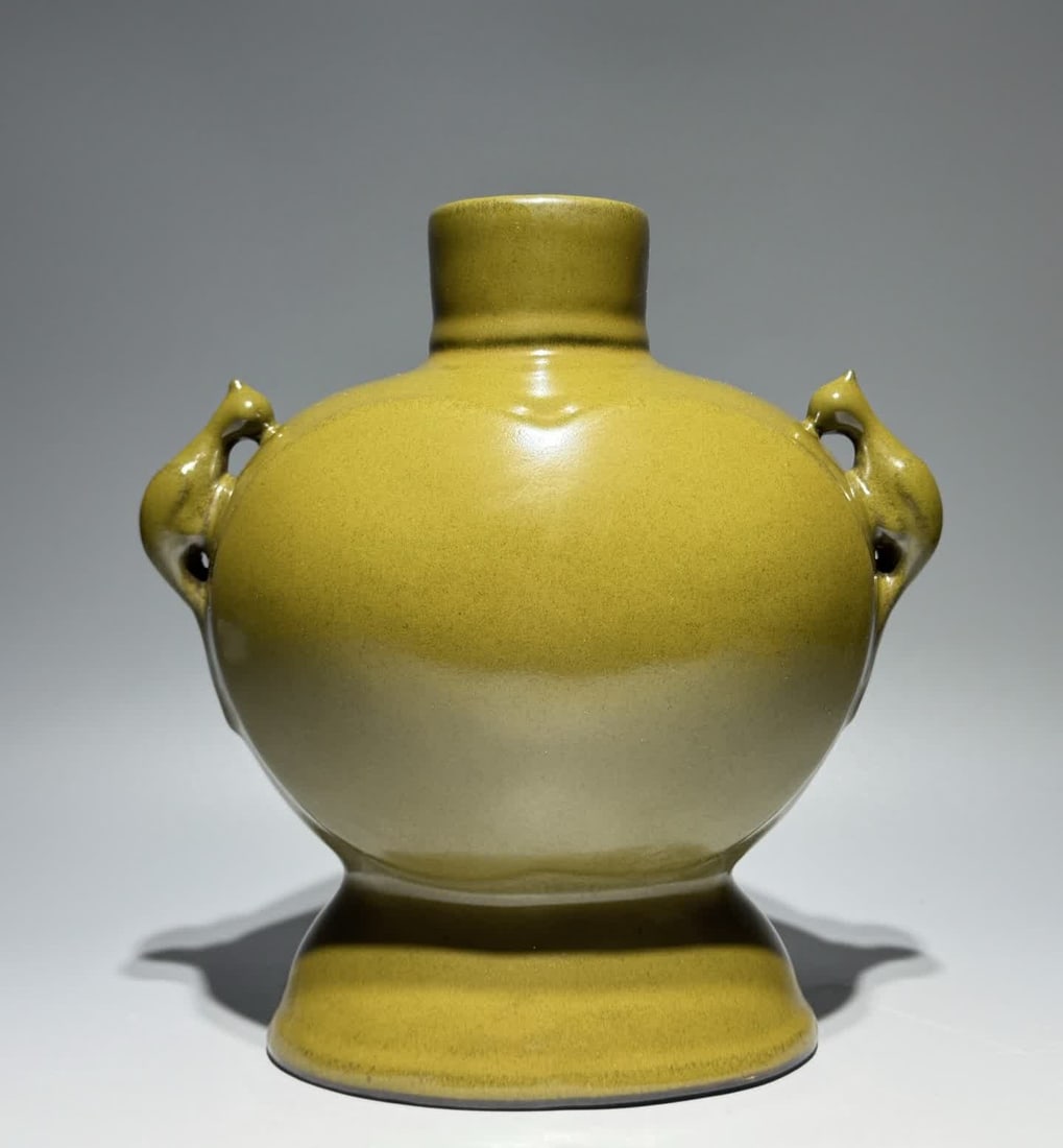 A Qing Yongzheng tea powder glazed parrot ear flat pot: Qing Yongzheng tea powder glazed parrot ear flat pot SIZE: Height 23.8cm Width 22.5cm (The Dimensions Of All Batches Are Manually Measured.If You Need More Detailed Information, Please Contact