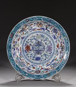 A Qing Yongzheng blue and white colorful entwined eight treasure plate