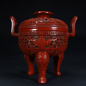 Qing Qianlong red Kui dragon pattern three-legged lid furnace