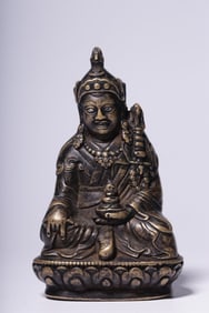 A seated statue of a copper lotus peanut in the Qing Dynasty