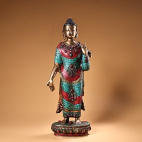 A gemstone inlaid with gold painted Shakyamuni Buddha