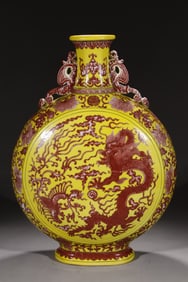 A Qing Qianlong yellow ground glaze red entwined dragon and phoenix pattern animal ear flat bottle