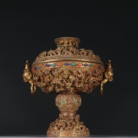 A silver-gilt double beast earring fried bead dish