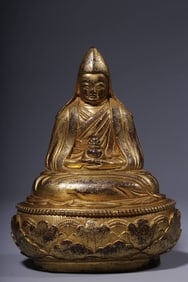A seated statue of a bronze gilt guru in the Qing Dynasty