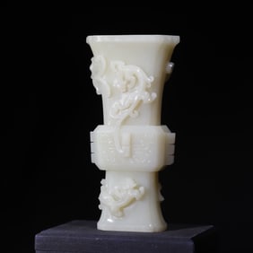 A Qing Dynasty five-dragon six-edged jade cup
