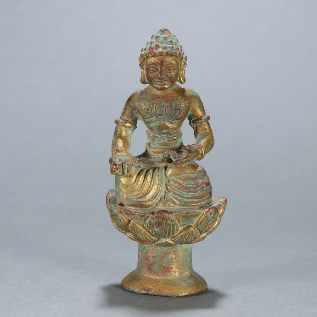 A copper gilt Buddha ornament (1 of 9)