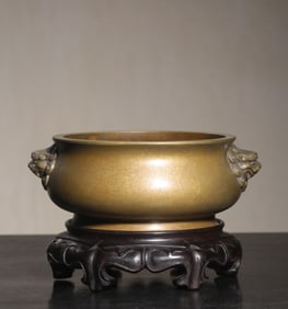 A Qing Dynasty copper lion ear furnace