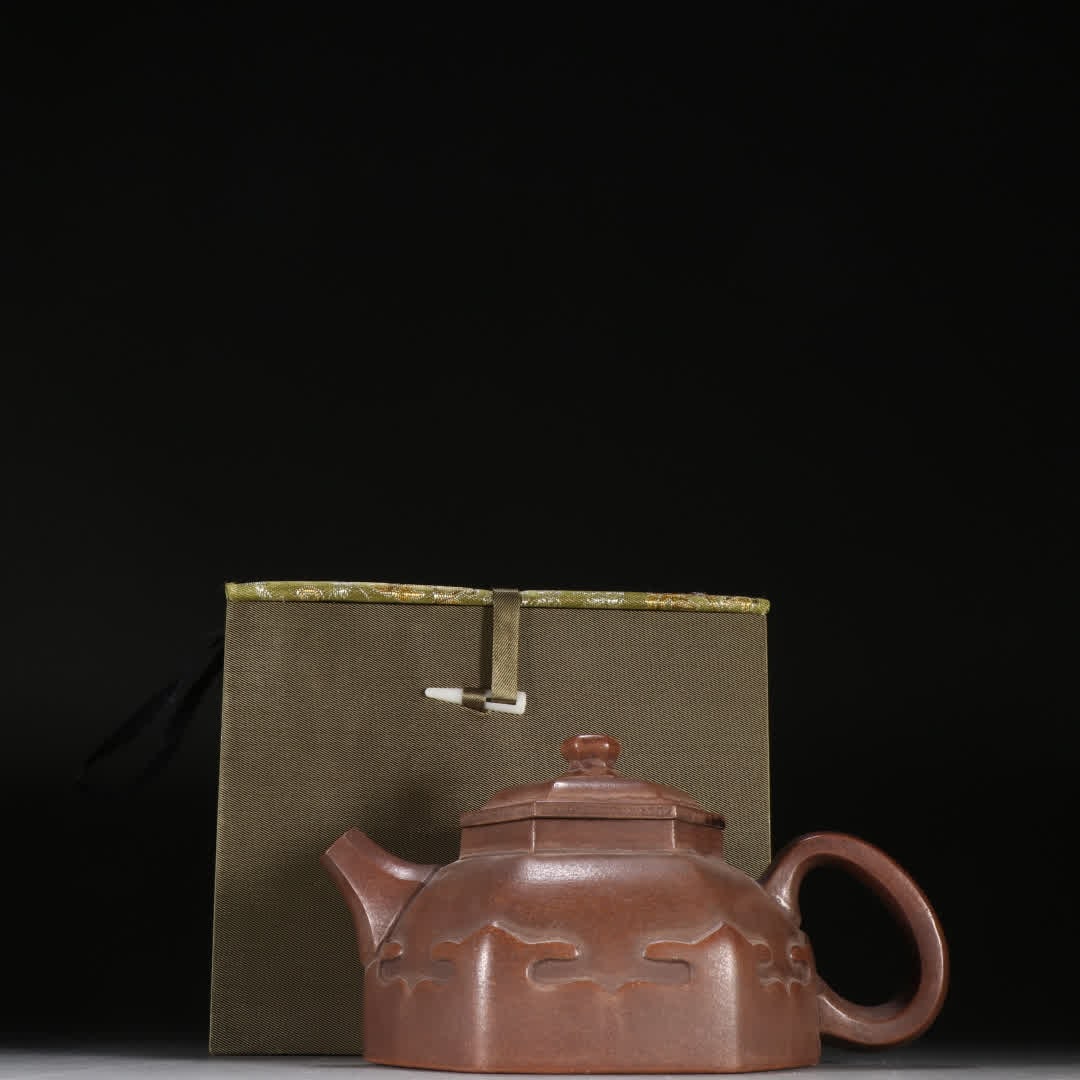 A Qing Dynasty purple sand six-way ruyi teapot: Qing Dynasty purple sand six-way ruyi teapot SIZE: Height 10cm Width 18cm (The Dimensions Of All Batches Are Manually Measured.If You Need More Detailed Information, Please Contact Our Customer