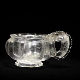 A Qing Dynasty natural crystal carved dragon handle flower mouth cup