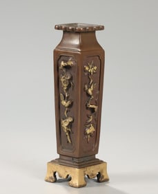 A Qing Dynasty bronze gilt flower and bird incense bottle