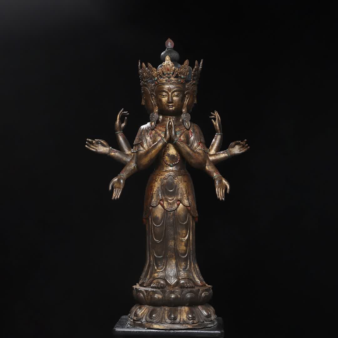 A bronze clay gold eight-armed Guanyin statue (1 of 9)