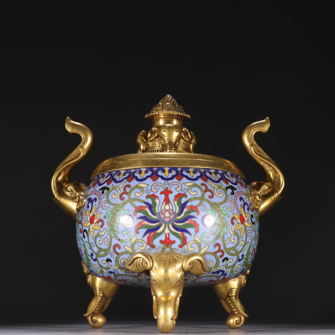 A piece of Qing Dynasty copper gilt cloisonné painting enamel entwined lotus pattern elephant ear: Qing Dynasty copper gilt cloisonné painting enamel entwined lotus pattern elephant ear three-legged aromatherapy stove SIZE: Height 16.9cm Width 17.5cm Weight 2503.6g (The Dimensions Of All Batches A