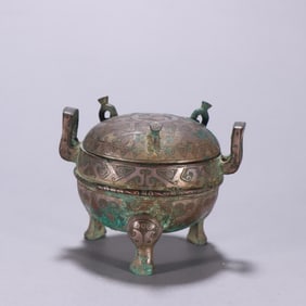 A Han Dynasty copper gold and silver three-legged lid furnace