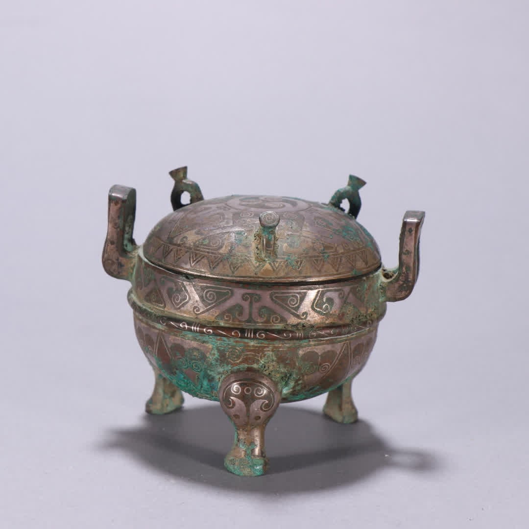 A Han Dynasty copper gold and silver three-legged lid furnace (1 of 9)