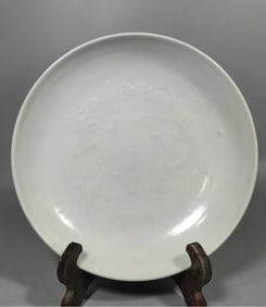 A Ming Dynasty sweet white glaze carved dragon plate