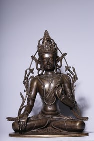 A seated statue of Guanyin in the Qing Dynasty alloy copper and silver