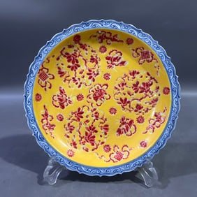 A Qing Dynasty Qianlong imperial blue and white lace yellow ground safflower plate