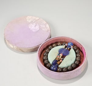 A piece of Qing Dynasty Qi Nan agarwood 18 seeds held