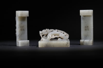A set of Qing Dynasty green and white jade dragon set