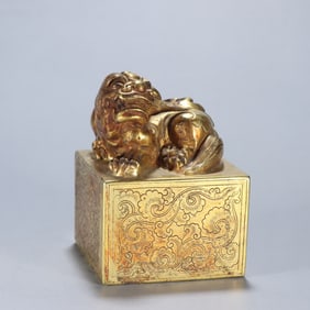 A silver-gilt beast button seal