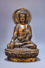 A piece of Qing Dynasty agarwood lacquered gold Shakyamuni Buddha