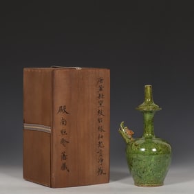 A piece of Tanggong County kiln twisted tire green glazed dragon head clean bottle