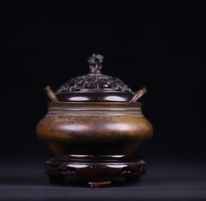 A Qing Dynasty copper rope ear three-legged incense burner