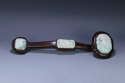 A rosewood inlaid jadeite entwined floral pattern ruyi ornament