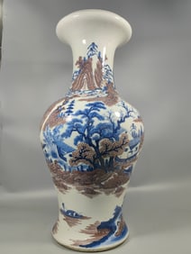A Qing Dynasty blue and white glazed red mountain water vase