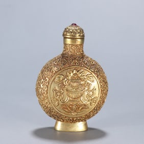 A Qing Dynasty copper gilt eight-treasure pattern snuff bottle