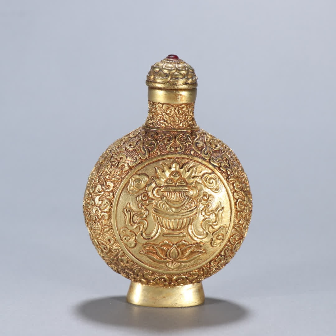 A Qing Dynasty copper gilt eight-treasure pattern snuff bottle (1 of 9)