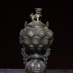 A piece of copper gilt anemone lion lid incense burner