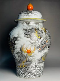 A Qianlong imperial ink color gold-painted Canglong godson general jar