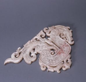 An ancient jade dragon pendant