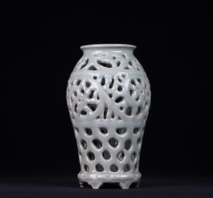 A Yuan Dynasty celadon hollow carved entwined vase