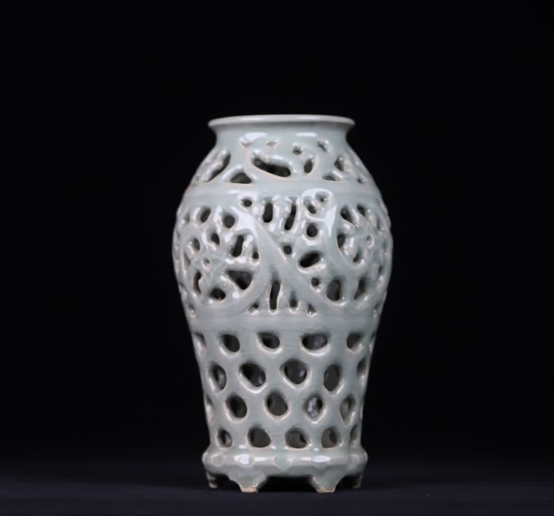 A Yuan Dynasty celadon hollow carved entwined vase (1 of 9)