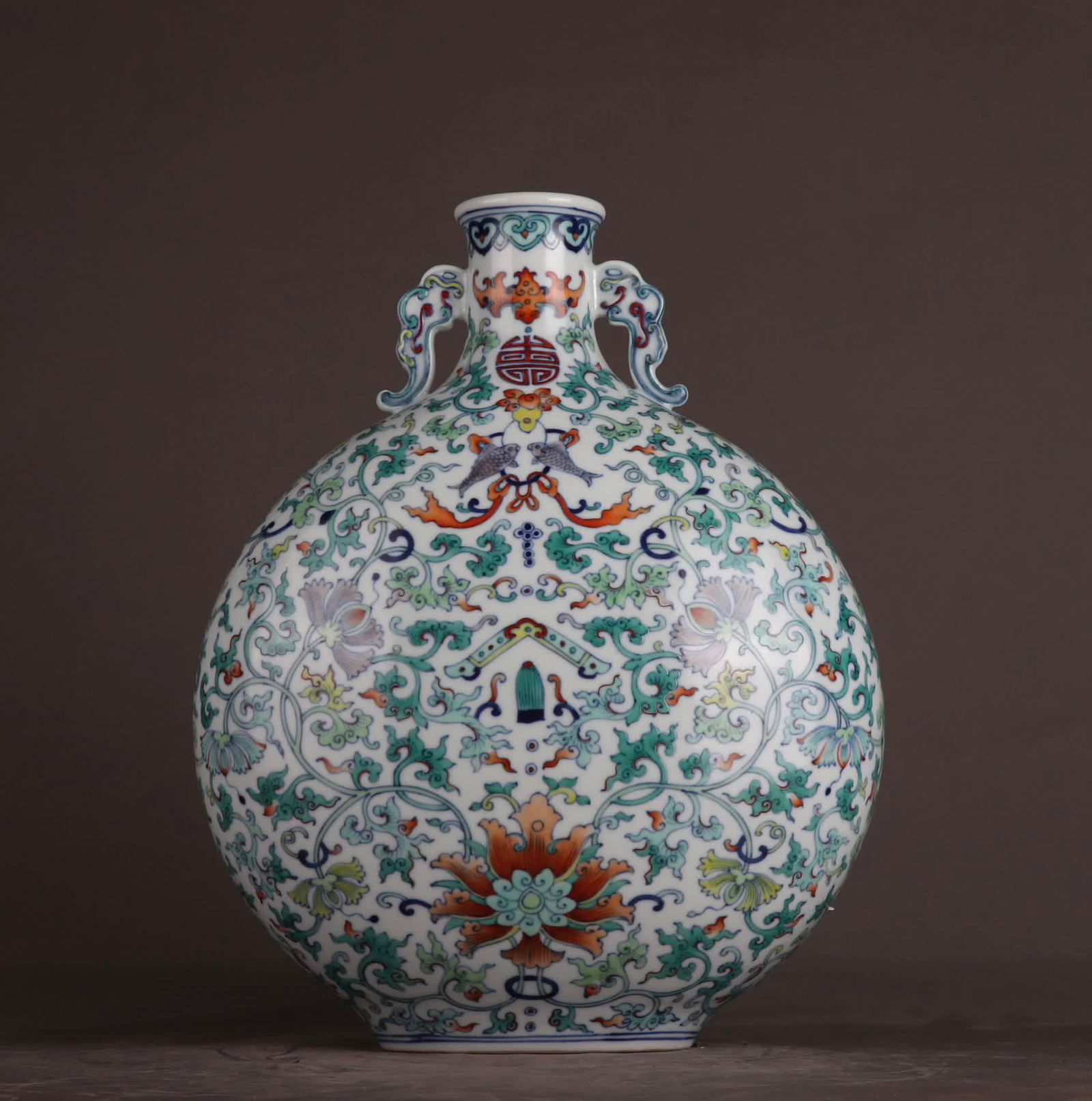 A Qing Qianlong Doucai entwined flower auspicious celebration has more than a moon vase: Qing Qianlong Doucai entwined flowers auspicious celebration has more than a moon vase SIZE: Height 33.3cm Belly diameter 25cm (The Dimensions Of All Batches Are Manually Measured.If You Need