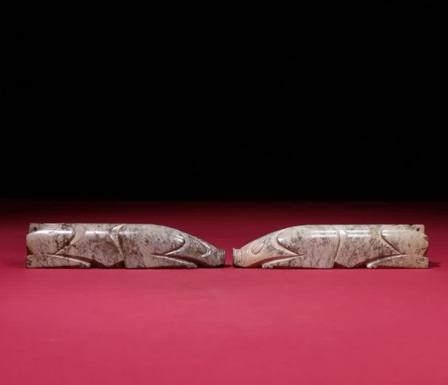 A pair of Han Dynasty seed material jade pig grips (1 of 9)